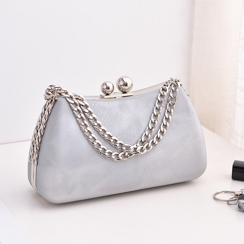 
The Vesper — Chain-strap minimalism for the evening after the day.