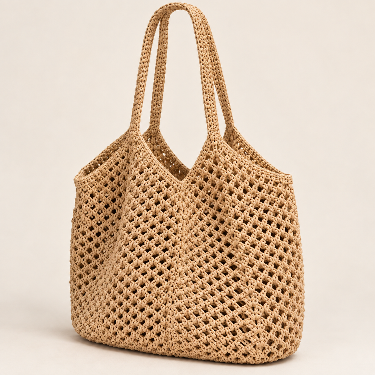 
The Ibiza woven beach tote in Beige, studio shot.