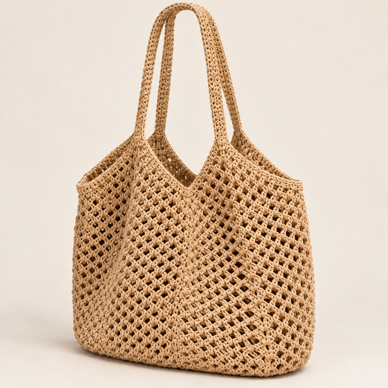 
The Ibiza woven beach tote in Beige, studio shot.