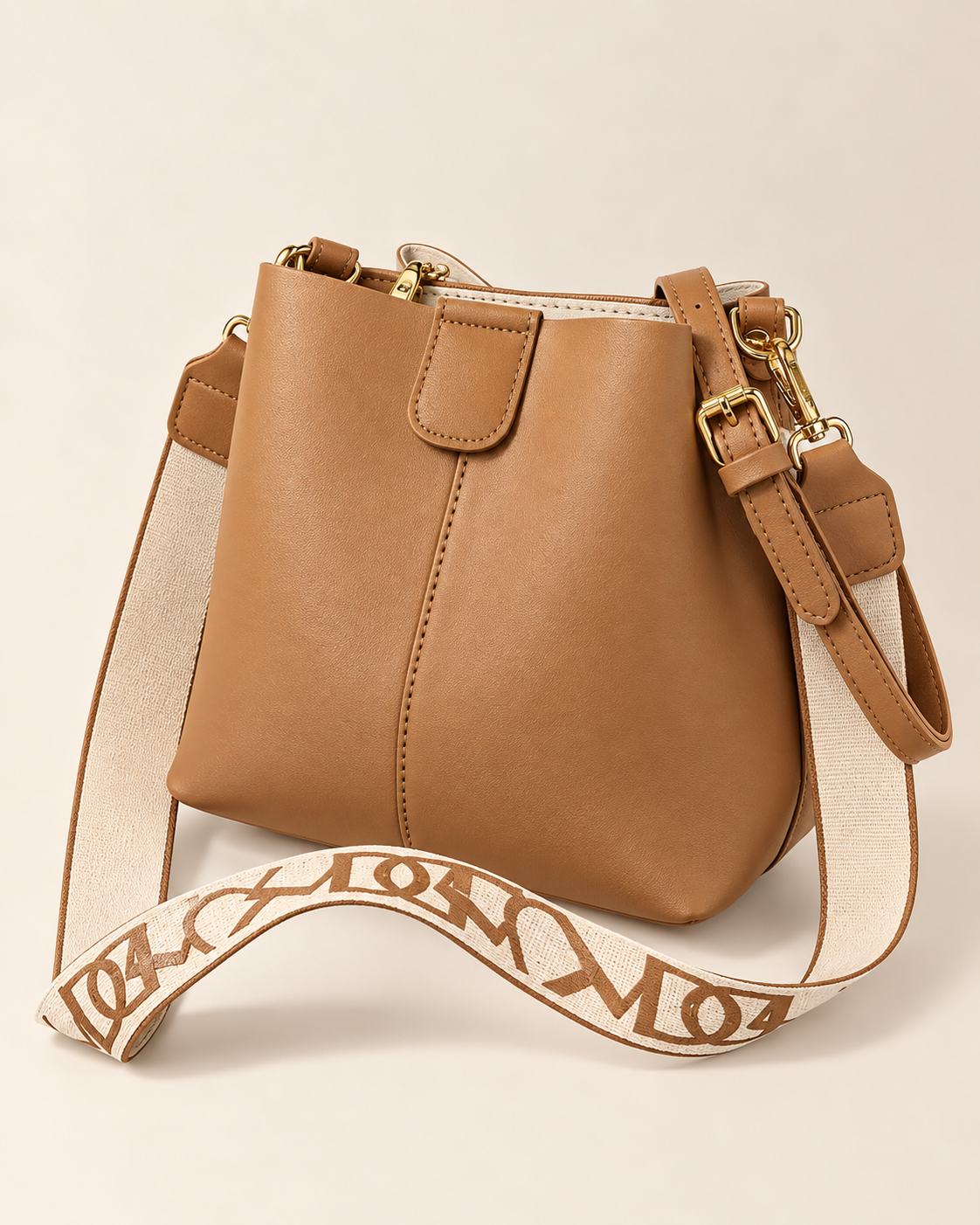 
The Cannes bucket bag in Beige, studio shot.