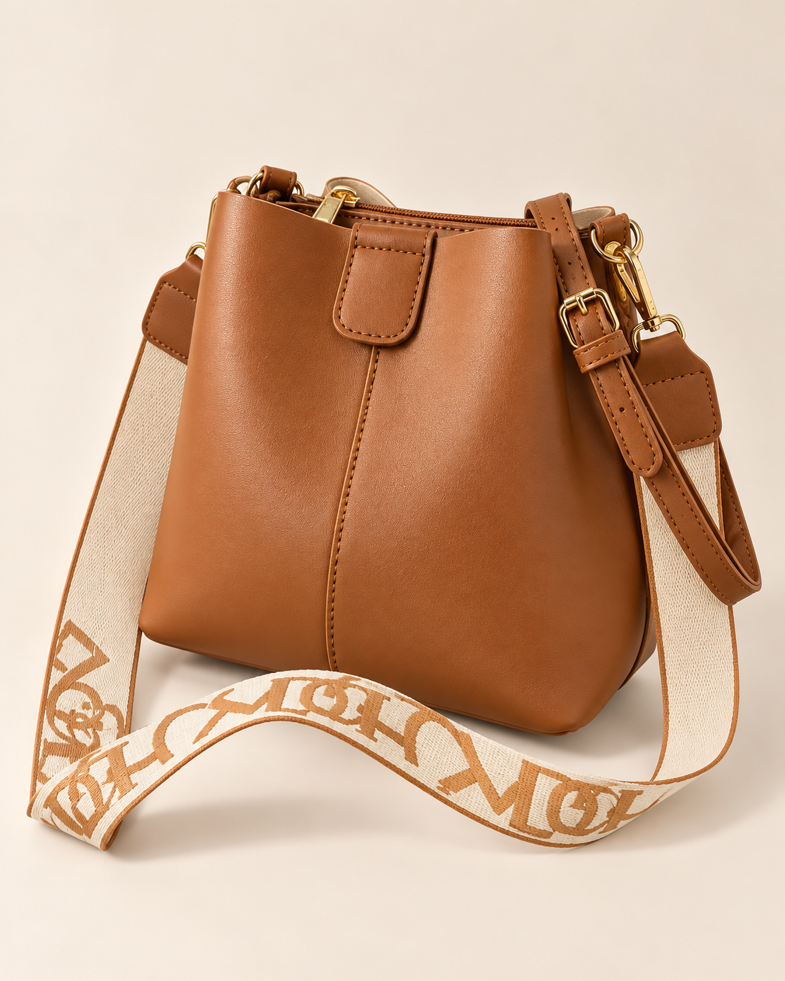 
The Cannes bucket bag in Brown, studio shot.