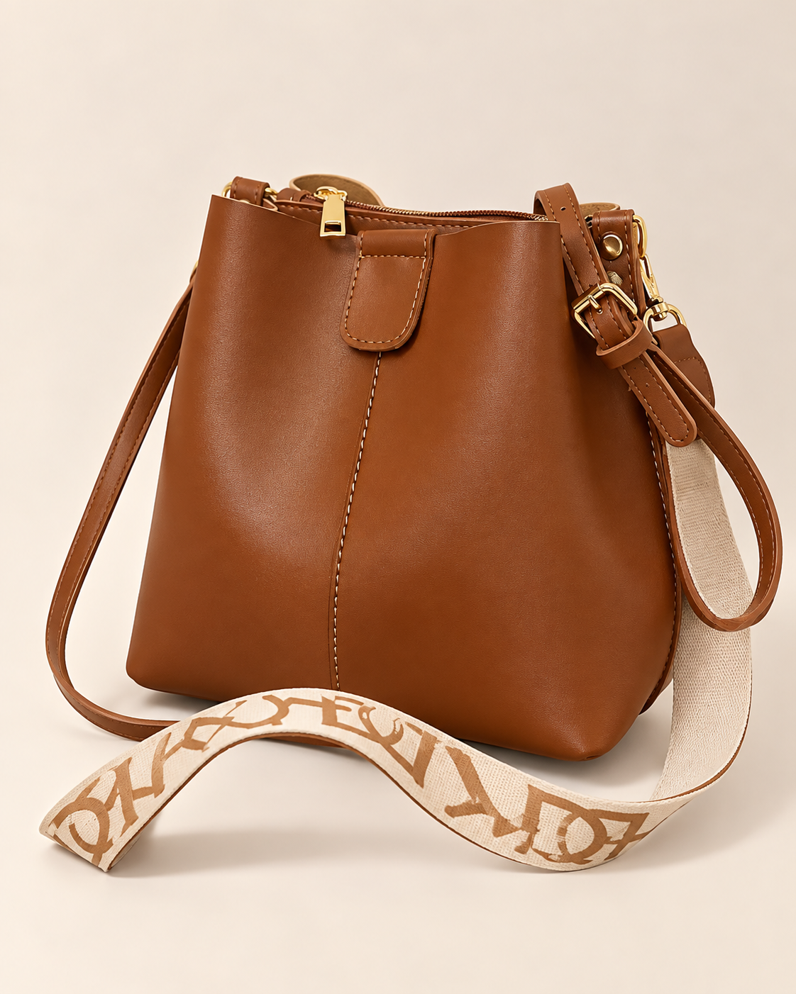 
The Cannes bucket bag in Coffee, studio shot.